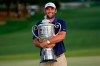 FILE - Scottie Scheffler holds the Wanamaker trophy after winning the PGA Championship golf tournament at the Quail Hollow Club, Sunday, May 18, 2025, in Charlotte, N.C. (AP Photo/David J. Phillip, File)