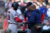 Boston Red Sox's Roman Anthony (19) has his hand looked at by trainer Brandon Henry as interim manager Chad Tracy (17) looks on against the Detroit Tigers during the first inning of a baseball game Monday, May 4, 2026, in Detroit. (AP Photo/Paul Sancya)