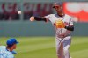 Cleveland Guardians second baseman Travis Bazzana throws to first for the double play hit into Vinnie Pasquantino after forcing Bobby Witt Jr. out at second during the third inning of a baseball game Thursday, May 7, 2026, in Kansas City, Mo. (AP Photo/Charlie Riedel)