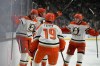 Anaheim Ducks center Leo Carlsson, left, celebrates after scoring against the Vegas Golden Knights during the third period of Game 2 of a second-round NHL hockey Stanley Cup playoff series Wednesday, May 6, 2026, in Las Vegas. (AP Photo/John Locher)