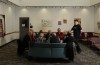 Edwin Bergsson speaks with members from the Muffin Break stamp club while at work at the Second Chance Cafe, a workplace staffed by survivors of brain injury located inside the Cedar Hill Recreation Centre in Saanich, B.C., on Wednesday, March 25, 2026. THE CANADIAN PRESS/Chad Hipolito