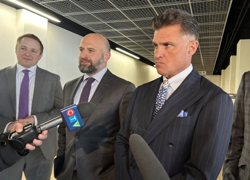 Criminal defence lawyers Matthew Ackerman, left to right, Zachary Al-Khatib and Dino Bottos speak to media outside the Edmonton Law Courts building in Edmonton on Friday, April 24, 2026. The lawyers are representing self-style spiritual leader Johannes (John) de Ruiter and his wife, Leigh Ann, who were facing six counts of sexual assault each before Crown prosecutors stayed the charges last week. THE CANADIAN PRESS/Daniela Germano
