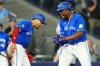 Toronto Blue Jays' Jesus Sanchez (12) celebrates his sixth-inning grand slam against the Miami Marlins with Lenyn Sosa (50), left, during MLB action in Toronto on Tuesday May 26, 2026. THE CANADIAN PRESS/Frank Gunn