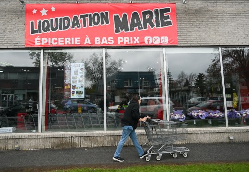 A person enters a Liquidation Marie grocery store in Longueuil, Que., on Thursday, May 14, 2026. THE CANADIAN PRESS/Graham Hughes