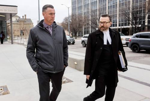 FREE PRESS PHOTO
                                Jonathan Kiazyk leaves the law courts with his lawyer Mike Cook Monday. Kiazyk pleaded not guilty to charges of entering a dwelling with intent to commit theft, obstructing a police officer and breach of trust.