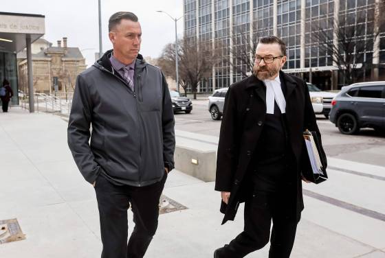 Jonathan Kiazyk leaves the law courts with his lawyer Mike Cook Monday. (Free Press photo)