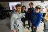From left: Grade 8 students Nathaniel Thiessen Unger, Julian Evans and Kayden Tully participated in General Wolfe School’s media literacy competition, organized by teacher Devin King (second from right). (Mike Deal / Free Press)