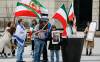 JOHN WOODS / FREE PRESS
                                People gather at the corner of Portage and Main in Winnipeg to rally for regime change in Iran, Sunday.