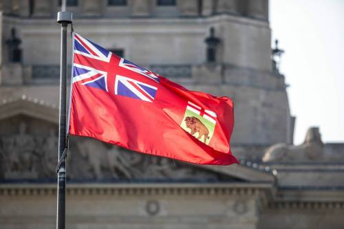 MIKAELA MACKENZIE / FREE PRESS files
                                The Manitoba flag flies at the legislature in 2024. A Probe Research poll taken that year found 49 per cent of Manitobans would support creating a new flag for the province.