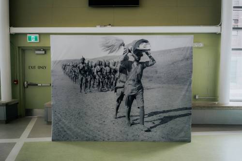 SANDEEP SINGH PHOTO
                                The exhibit includes a reproduction of a historic photo by photojournalist Ariel Varges
                                showing men of the 45th Sikhs (52nd Infantry Brigade, 17th Division)
                                marching with the Guru Granth Sahib to attend a Diwan (religious
                                service) while on campaign in Mesopotamia.