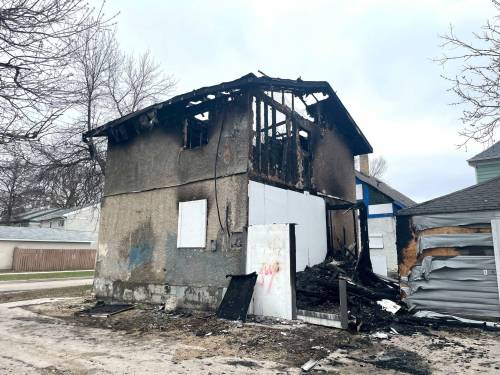 Ruth Bonneville / Free Press
                                The remnants of a fire in a vacant, two-storey house and adjacent garage at 274 Powers St., Tuesday. One of several blazes that ripped through vacant homes so far this week.