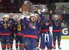 Marlen Edwards lifts the Centennial Cup into the air after helping the Niverville Nighthawks to a national championship. (Cassidy Dankochik / The Carillon)