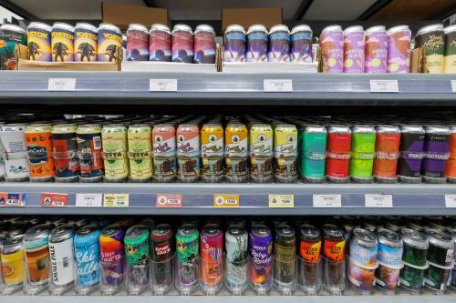 MIKE DEAL / FREE PRESS
                                Local craft brews line the shelves at the Quality Inn Beer Store on Weatherdon Avenue.