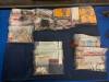 Ammunition, cash and other items seized by Winnipeg police (Nicole Buffie / Free Press)
