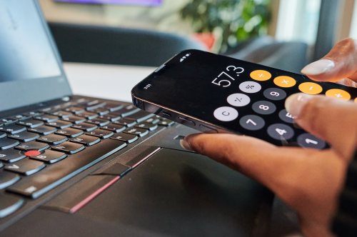 A person uses the calculator app on their phone in a photo illustration made in Toronto, on Monday, Sept. 22, 2025. THE CANADIAN PRESS/Sammy Kogan