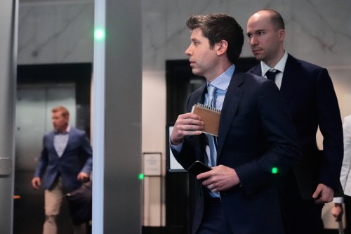 Sam Altman, center, and OpenAI president Greg Brockman, right, arrive at the U.S. District Court in Oakland, Calif., Thursday, April 30, 2026. (AP Photo/Godofredo A. Vásquez)