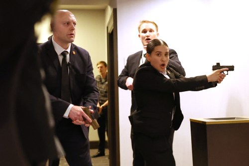 FILE - Secret service agents respond when a man, who authorities say, tried to storm the White House Correspondents' Association dinner with guns and knives, in Washington, April 25, 2026. (AP Photo/Tom Brenner, File)