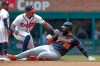 Detroit Tigers' Gleyber Torres (25) is tagged out by Atlanta Braves shortstop Jorge Mateo (2) while trying to stretch a single into a double during the fifth inning of a baseball game, Thursday, April 30, 2026, in Atlanta. (AP Photo/Erik S. Lesser)
