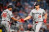 Minnesota Twins' Matt Wallner (38) celebrates his home run with third base coach Ramon Borrego (46) during the fifth inning of a baseball game against the Washington Nationals, Wednesday, May 6, 2026, in Washington. (AP Photo/Nick Wass)