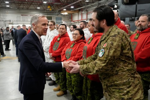 Prime Minister Mark Carney shakes hands with members of the Canadian Forces following an announcement to defend and transform Canada's Northern and Arctic regions in Yellowknife, N.W.T., Thursday, March 12, 2026. THE CANADIAN PRESS/Adrian Wyld