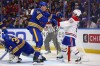 Montreal Canadiens right wing Cole Caufield (13) is pushed out of the crease by Buffalo Sabres defenseman Logan Stanley (64) during the second period in Game 1 of a second-round NHL hockey Stanley Cup playoff series, Wednesday, May 6, 2026, in Buffalo, N.Y. (AP Photo/Jeffrey T. Barnes)