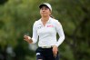 Jeeno Thitikul, of Thailand, waves after making a putt on the 13th hole during the second round of the Chevron Championship LPGA golf tournament Friday, April 24, 2026, in Houston. (AP Photo/Ashley Landis)