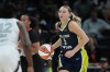 Dallas Wings guard Paige Bueckers (5) moves the ball up court against the Las Vegas Aces during the second half of a WNBA preseason basketball game in Austin, Texas, Sunday, May 3, 2026. (AP Photo/Eric Gay)