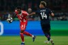 PSG's Desire Doue, right, tries to stop Bayern's Alphonso Davies during the Champions League semifinal first leg soccer match between Paris Saint-Germain and Bayern Munich in Paris, Tuesday, April 28, 2026. (AP Photo/Christophe Ena)