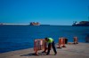 A worker prepares the area where passengers from the MV Hondius cruise ship are expected to arrive at the port of Granadilla in Tenerife, Canary Islands, Spain, Friday, May 8, 2026. (AP Photo/Manu Fernandez)