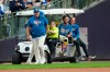Milwaukee Brewers' Brandon Lockridge is carted off the field after suffering an injury during the fourth inning of a baseball game against the New York Yankees, Friday, May 8, 2026, in Milwaukee. (AP Photo/Aaron Gash)