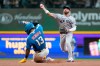 New York Yankees' José Caballero, right, throws to first base to turn a double play after tagging Milwaukee Brewers' Luis Rengifo (13) out at second base during the seventh inning of a baseball game, Friday, May 8, 2026, in Milwaukee. (AP Photo/Aaron Gash)