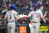 New York Mets' Mark Vientos (27) celebrates with Carson Benge (3) after hitting a solo home run against the Arizona Diamondbacks in the second inning of a baseball game, Friday, May 8, 2026, in Phoenix. (AP Photo/Rick Scuteri)