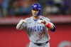 Chicago Cubs' Seiya Suzuki gestures while running the bases after hitting a two-run home run off Texas Rangers starting pitcher Kumar Rocker during the fourth inning of a baseball game Friday, May 8, 2026, in Arlington, Texas. (AP Photo/Julio Cortez)