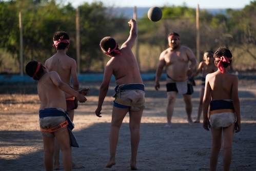 Youth play ulama, a traditional Mesoamerican ballgame dating to pre-Hispanic times, in Los Llanitos on the outskirts of Mazatlan, Mexico, Saturday, April 25, 2026. (AP Photo/Marco Ugarte)