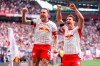 Leipzig's Willi Orban, right, celebrates with and David Raum after scoring, during the German Bundesliga soccer match between RB Leipzig and FC St. Pauli, in Leipzig, Germany, Saturday, May 9, 2026. (Jan Woitas/dpa via AP)