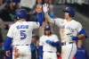 Toronto Blue Jays' Brandon Valenzuela (59) is congratulated as he crosses home plate by teammate Daulton Varsho (5) after hitting a three run home run off Los Angeles Angels pitcher Mitch Farris during fifth inning MLB baseball action in Toronto, Saturday, May 9, 2026. THE CANADIAN PRESS/Chris Young