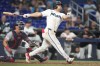 Miami Marlins' Jakob Marsee, right, watches after hitting a three run home run during the eighth inning of a baseball game against the Washington Nationals, Saturday, May 9, 2026, in Miami. (AP Photo/Lynne Sladky)