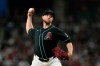 Arizona Diamondbacks starting pitcher Merrill Kelly throws against the New York Mets during the first inning of a baseball game, Saturday, May 9, 2026, in Phoenix. (AP Photo/Ross D. Franklin)