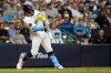 Milwaukee Brewers' William Contreras hits an RBI single during the eighth inning of a baseball game against the New York Yankees, Saturday, May 9, 2026, in Milwaukee. (AP Photo/Aaron Gash)