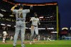 Pittsburgh Pirates' Oneil Cruz (15) scores against the San Francisco Giants on Brandon Lowe's triple during the seventh inning of a baseball game Saturday, May 9, 2026, in San Francisco. (AP Photo/Godofredo A. Vásquez)