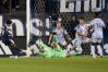 San Jose Earthquakes goalkeeper Daniel de Sousa Britto, bottom, defends a shot by Vancouver Whitecaps midfielder Jeevan Badwal, left, during the second half of an MLS soccer match Saturday, May 9, 2026, in San Jose, Calif. (AP Photo/Jeff Chiu)