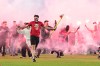 Fans get onto the pitch during the Czech league soccer derby match between Sparta Prague and Slavia Prague in Prague, Saturday, May 9, 2026. (Michal Kamaryt/CTK via AP)