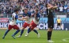 Hamburger's Luka Vuskovic, centre, celebrates with Nicolai Remberg, second from left, and Nicolas Capaldo after scoring his side's second goal during the German Bundesliga soccer match between Hamburger SV and Sport-Club Freiburg in Hamburg, Germany, Sunday, May 10, 2026. (Marcus Brandt/dpa via AP)