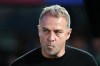 Barcelona head coach Hansi Flick stands by the touchline before the Spanish La Liga soccer match between FC Barcelona and Real Madrid in Barcelona, Spain, Sunday, May 10, 2026. (AP Photo/Joan Mateu Parra)