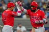 Los Angeles Angels second baseman Oswald Peraza (2) congratulates teammate right-fielder Jo Adell (7) after Adell hit a solo home run during the top of the sixth inning MLB baseball action against Toronto Blue Jays in Toronto on Sunday, May 10, 2026. THE CANADIAN PRESS/Frank Gunn