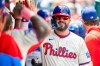 Philadelphia Phillies' Kyle Schwarber is cheered in the dugout after hitting a solo home run in the first inning of a baseball game against the Colorado Rockies, Sunday, May 10, 2026, in Philadelphia. (AP Photo/Laurence Kesterson)