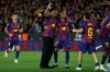 Barcelona's Lamine Yamal and Raphinha Barcelona celebrate after winning the Spanish La Liga soccer match between FC Barcelona and Real Madrid that makes them Spanish league champions in Barcelona, Spain, Sunday, May 10, 2026. (AP Photo/Joan Monfort)