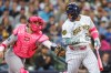 New York Yankees catcher J.C Escarra tags out Milwaukee Brewers' William Contreras after he struck out during the first inning of a baseball game Sunday, May 10, 2026, in Milwaukee. (AP Photo/Jeffrey Phelps)