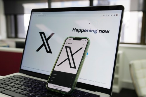 FILE — The opening page of X is displayed on a computer and phone, Oct. 16, 2023, in Sydney. (AP Photo/Rick Rycroft, File)