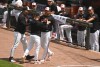 Baltimore Orioles' infield coach Miguel Cairo, center, argues after being ejected from a baseball game against the Athletics, Sunday, May 10, 2026, in Baltimore. (AP Photo/Steve Ruark)